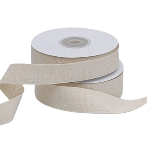 Roll of natural beige herringbone cotton tape for DIY sewing and gift wrapping