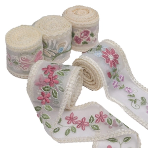 Stack of 9cm milk silk mesh lace ribbons with floral embroidery and wavy scalloped edges