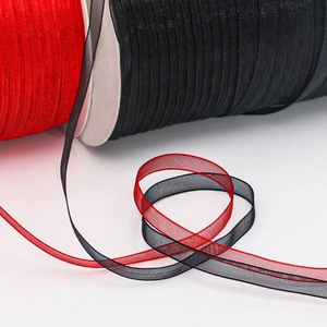 Detail view of 6mm red and black sheer organza ribbon with fine finished edges
