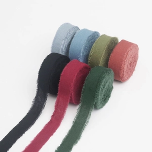 Detailed macro view of seven colorful frayed edge chiffon ribbons for gift wrapping and DIY