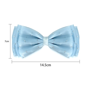 Detail view of a 14.5x7cm light blue satin bow with sparkling silver rhinestones