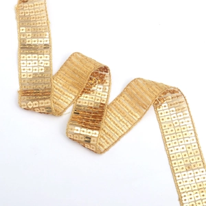 Metallic gold sequin ribbon lace trim on white mesh base for dresses and DIY crafts