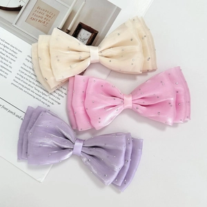 Three-piece rhinestone mesh bow hair clips in beige, pink and lavender purple colors