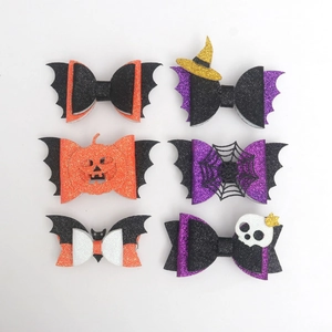 Set of 6 Halloween glitter hair clips featuring pumpkin, bat, and spider web designs