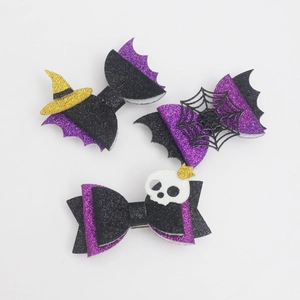 Halloween bow hair clips set with witch hat, spider web, and skull glitter designs