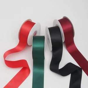 Detail of multi-colored satin ribbon rolls for gift wrapping and floral decoration