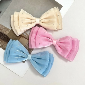 Three-piece set of layered mesh bow hair clips with silver rhinestones in pastel colors