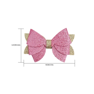 Barrette nœud papillon pailletée rose et dorée avec dimensions du produit