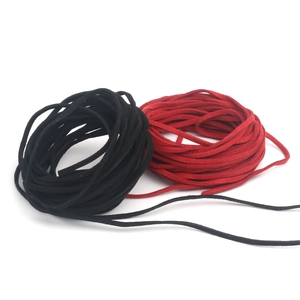 Detailed close-up of 2.6mm black and red suede faux leather cords for DIY craft and sewing