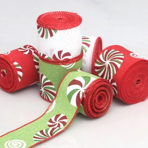 Detail view of linen-style Christmas ribbons with peppermint candy prints and red stitched edges