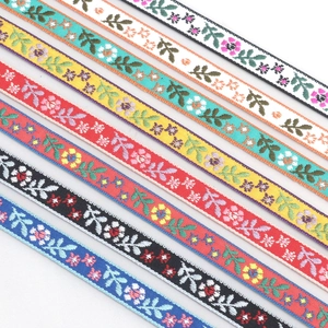 Detailed macro view of colorful ethnic floral jacquard ribbons with varied patterns