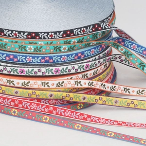 Close-up of assorted colorful floral embroidery jacquard ribbons for garment sewing