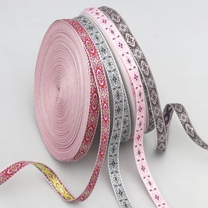 Detailed macro view of 1.5cm jacquard ethnic ribbons with various colorful floral patterns