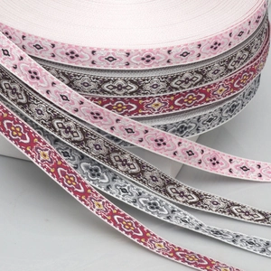 Detailed macro view of 1.5cm ethnic jacquard ribbon with vintage geometric floral patterns