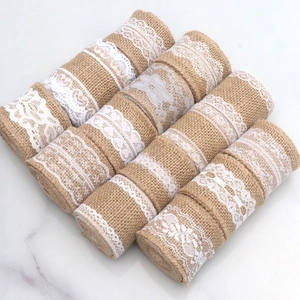 Rolls of natural jute burlap ribbon with assorted white lace patterns for DIY crafts
