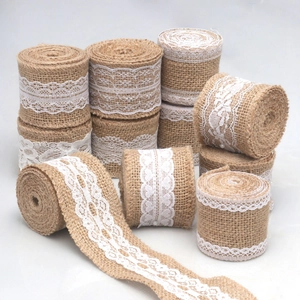 Natural burlap ribbon rolls with white lace trim for DIY wedding and Christmas crafts
