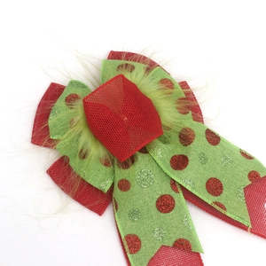 Large Christmas tree topper bow with green plush dots and feathers on red mesh