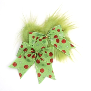 Set of two green plush Christmas bows with glitter polka dots for festive tree decoration