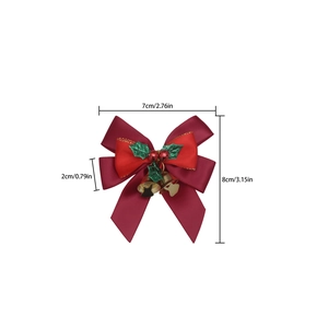Christmas bow ornament with red ribbons, green holly leaves and golden bells with dimensions