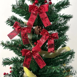 Set di quattro fiocchi natalizi con paillettes rosse e nastri dorati per l'albero