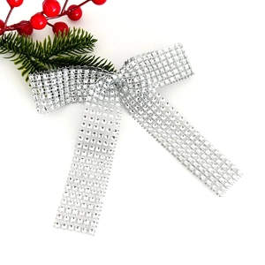 Sparkling silver sequin bow ornament with pine needles for Christmas wedding decor