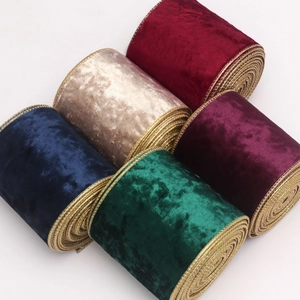 Five rolls of velvet Christmas ribbons with gold wired edges in assorted classic colors
