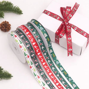 Detail of 1cm Christmas grosgrain ribbon set with reindeer and tree patterns for gift wrapping