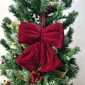 Large burgundy velvet Christmas bow with hanging loop for tree or party decor