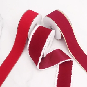 Three rolls of premium red velvet Christmas ribbons with gold edges and white faux fur trim