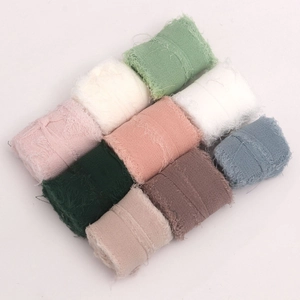 Close-up of nine assorted pastel frayed edge chiffon ribbons for wedding gift wrapping