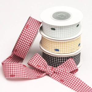 Detail of four-color plaid flocking ribbons with houndstooth dots for DIY craft projects