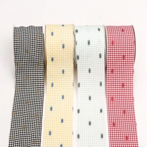 Close-up of multicolored gingham ribbons with flocked polka dots for DIY craft projects