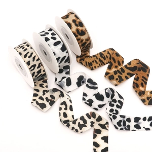 Rolls of leopard print ribbons in brown, white and beige for DIY bow hair accessories