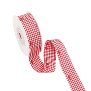 Red and white checkered ribbon with heart embroidery on a white spool for DIY crafts