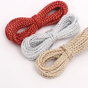 Close-up of 3mm metallic braided cords in red gold, silver and bronze for DIY crafts