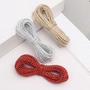 Detailed view of 3mm metallic braided ropes in gold, silver, and red for DIY crafts