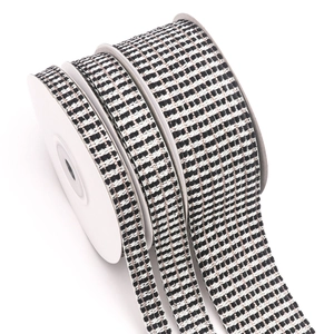 Rose gold woven ribbon with black and white checkerboard pattern and metallic thread