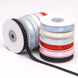 Detailed close-up of 1cm colorful polka dot satin ribbons for DIY gift wrapping and crafts