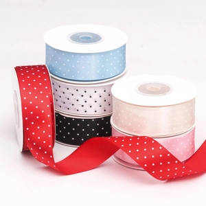 Close-up of 2.5cm satin polka dot ribbons in multiple colors for DIY gift wrapping