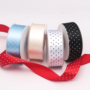 Detailed group view of colorful 2.5cm polka dot printed polyester ribbons for gift wrapping
