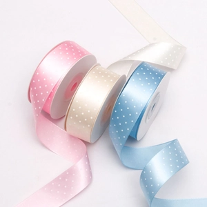 2.5cm wide polka dot polyester ribbons in pink, cream and blue for gift wrapping