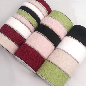 Macro shot of assorted colorful velvet ribbons with soft plush texture for DIY crafts
