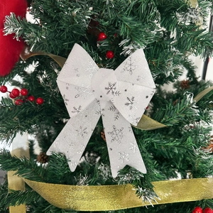 White silver snowflake bow Christmas tree ornament with glitter fabric and festive details