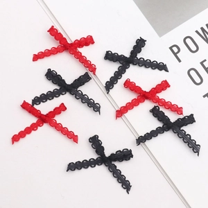 Detailed view of red and black lace cross knots for DIY hair accessories and clothing