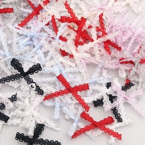 Close-up of colorful handmade polyester lace bow ornaments for DIY sewing and crafts