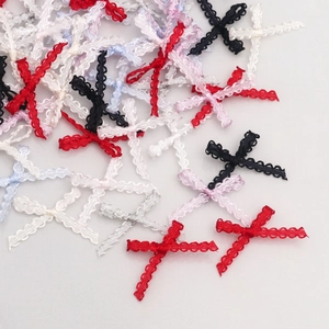 Detailed macro view of 0.3cm multi-colored lace cross bows for DIY garment accessories