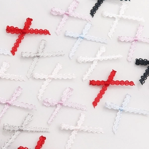 Macro shot of 0.3cm cross lace ribbons for DIY sewing accessories in multiple vibrant colors
