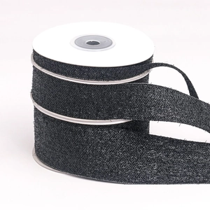 Detail of black glitter jute ribbon rolls for DIY crafts and gift wrapping
