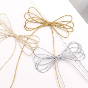Detail of 1mm gold and silver braided metallic cords for DIY Christmas gift packaging