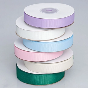 Set of six colorful grosgrain ribbons in violet white blue pink beige and dark green